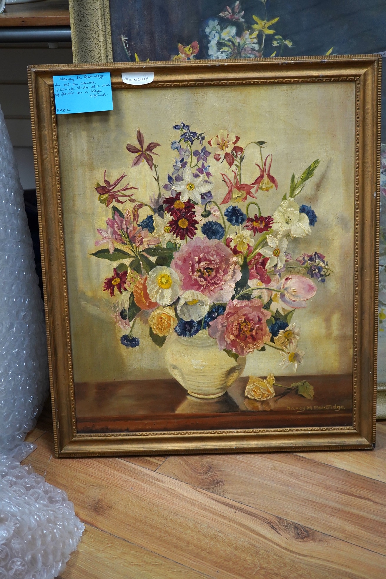 Nancy M Partridge, oil on canvas, Still life of flowers in a vase, signed, 59 x 49cm. Condition - fair